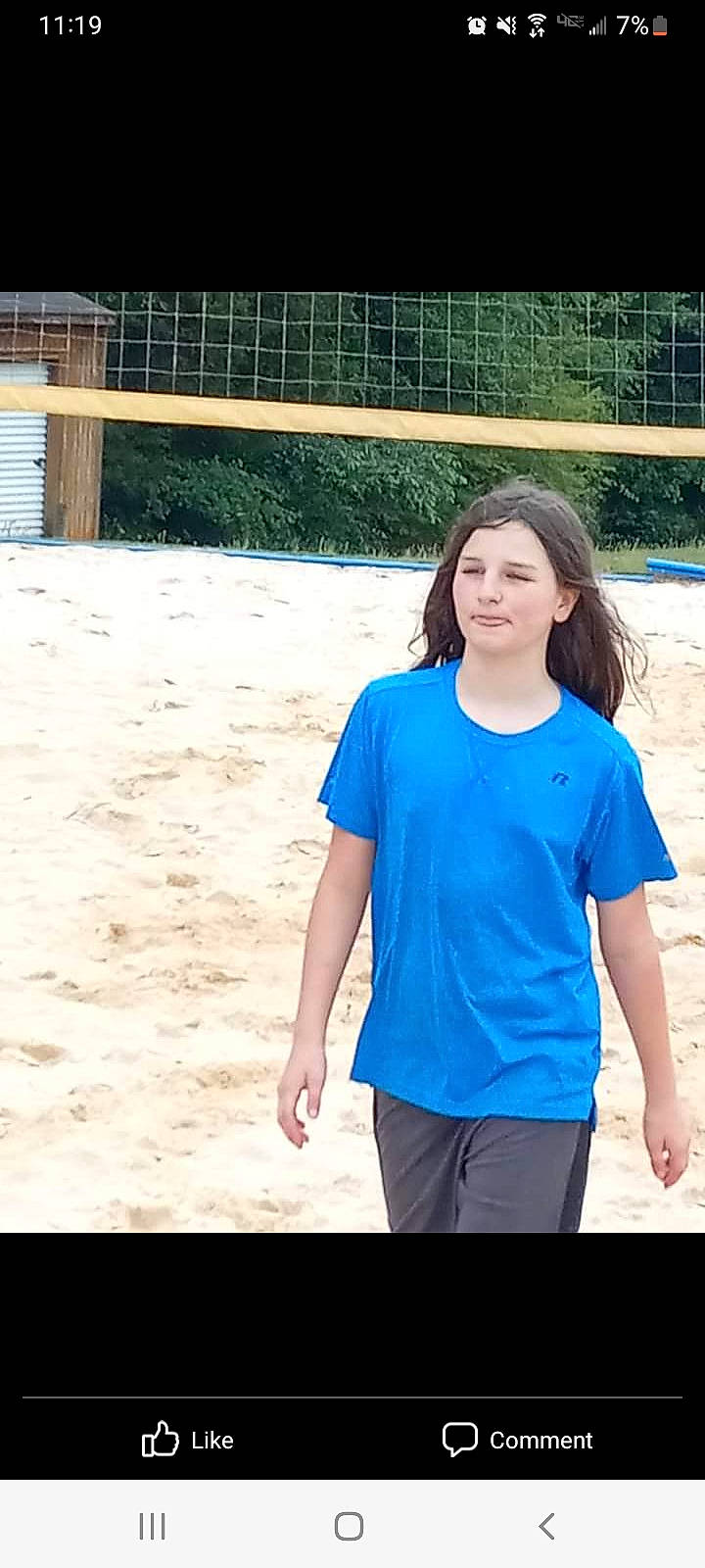 Riley is registered to the contest to win money with this photo: beach, body_of_water, chin, cool, electric_blue, flash_photography, fun, hairstyle, happy, leisure, person, recreation, sand, skin, sleeve, summer, t_shirt, thigh, travel, waist