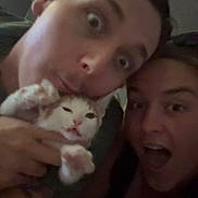 Pumpkin is registered to the contest to win money with this photo: animal, blurred, cat, closeup, cute, expression, face, funny, hand, happy, head, holding, indoor, mouth_open, paw, person, pet, selfie, two_people, young_adult