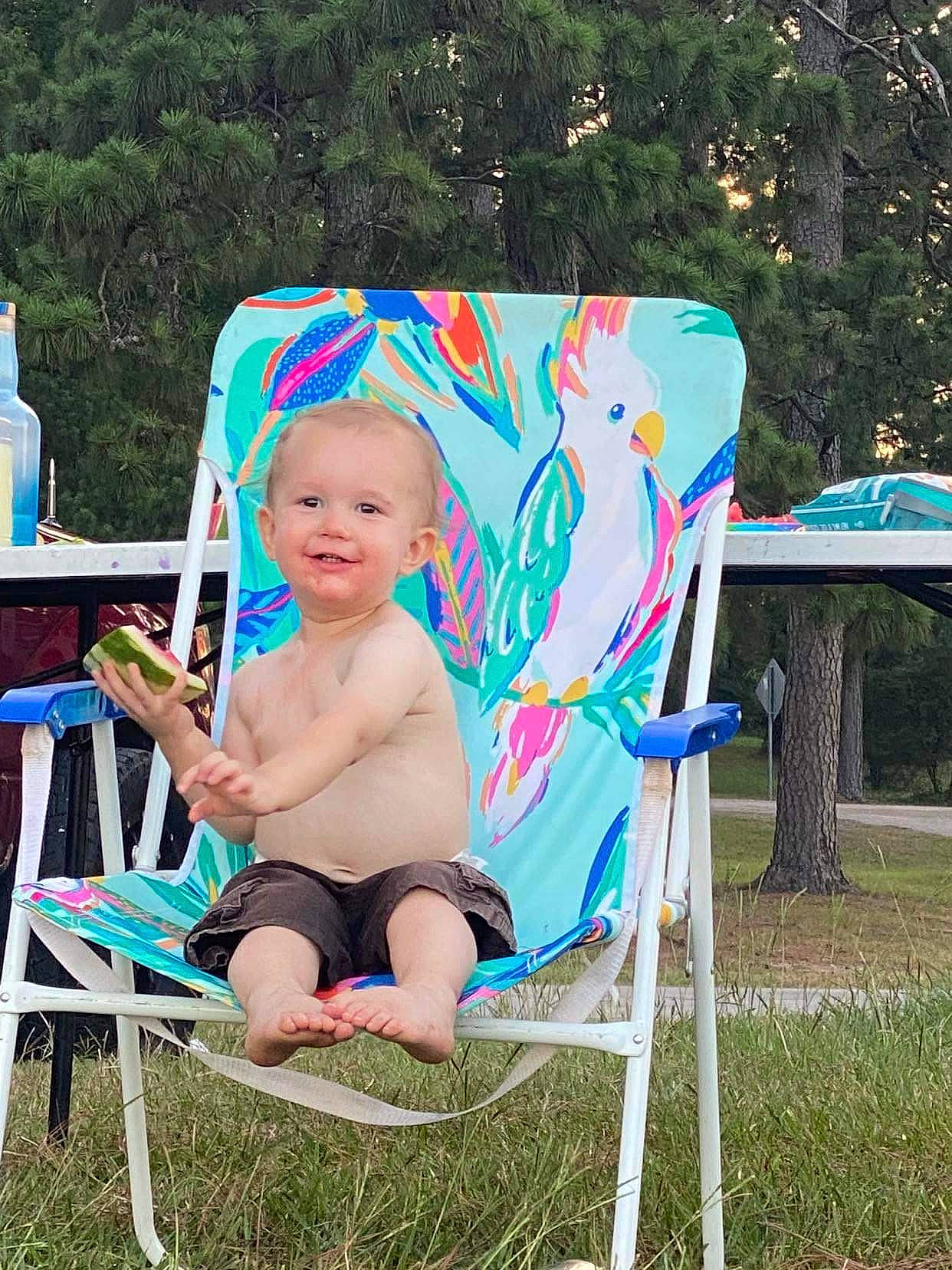 Joshua joined the competition — help win amazing prizes! baby, baby_toddler_clothing, blue, chair, electric_blue, event, folding_chair, fun, grass, hat, joy, leisure, outdoor_furniture, person, plant, recreation, sitting, smile, summer, tent