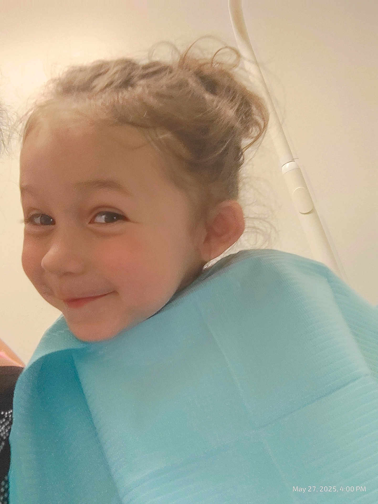 Jasmine joined the competition — help win amazing prizes! child, smile, face, curly_hair, blue_bib, indoor, portrait, young_child, cute, happy, person, head, expression, hair_bun, skin, closeup, childrens_clothing, playful, early_childhood, casual