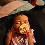 Liliana is registered to the contest to win money with this photo: baby, sleeping, pacifier, infant, cute, pink_clothing, hands, face, child, resting, indoors, soft_lighting, newborn, person, closeup, peaceful, bedtime, blanket, small_hands, portrait