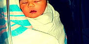 Liliana is registered to the contest to win money with this photo: newborn, baby, sleeping, blanket, hospital, bassinet, hat, wrapped, infant, child, peaceful, face, person, cute, soft, warm, resting, healthcare, bed, towel
