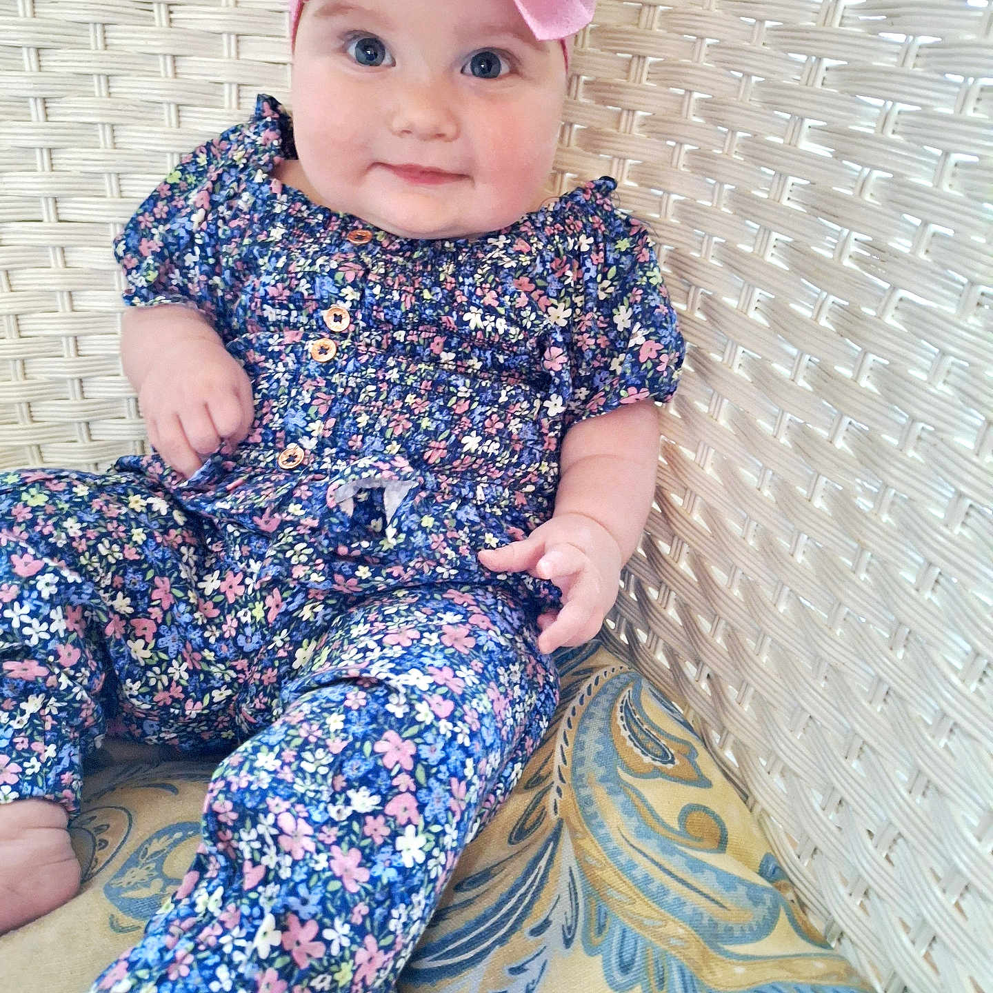 Adalynn joined the competition — help win amazing prizes! baby, bodypart, bonnet, cap, clothing, couch, dress, face, finger, formalwear, furniture, hand, hat, head, pajamas, pants, person, photography, portrait, sitting