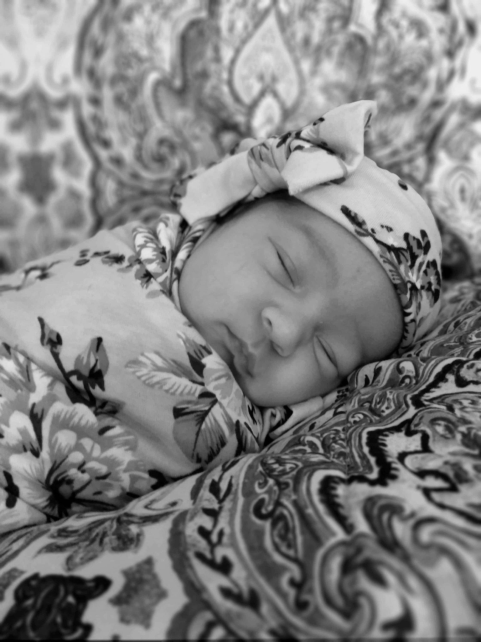 April is registered to the contest to win money with this photo: baby, baby_sleeping, baby_toddler_clothing, bedding, bedtime, black_and_white, child, comfort, eye, fur, grass, happy, head, headwear, linens, monochrome, monochrome_photography, pattern, person, sleeve