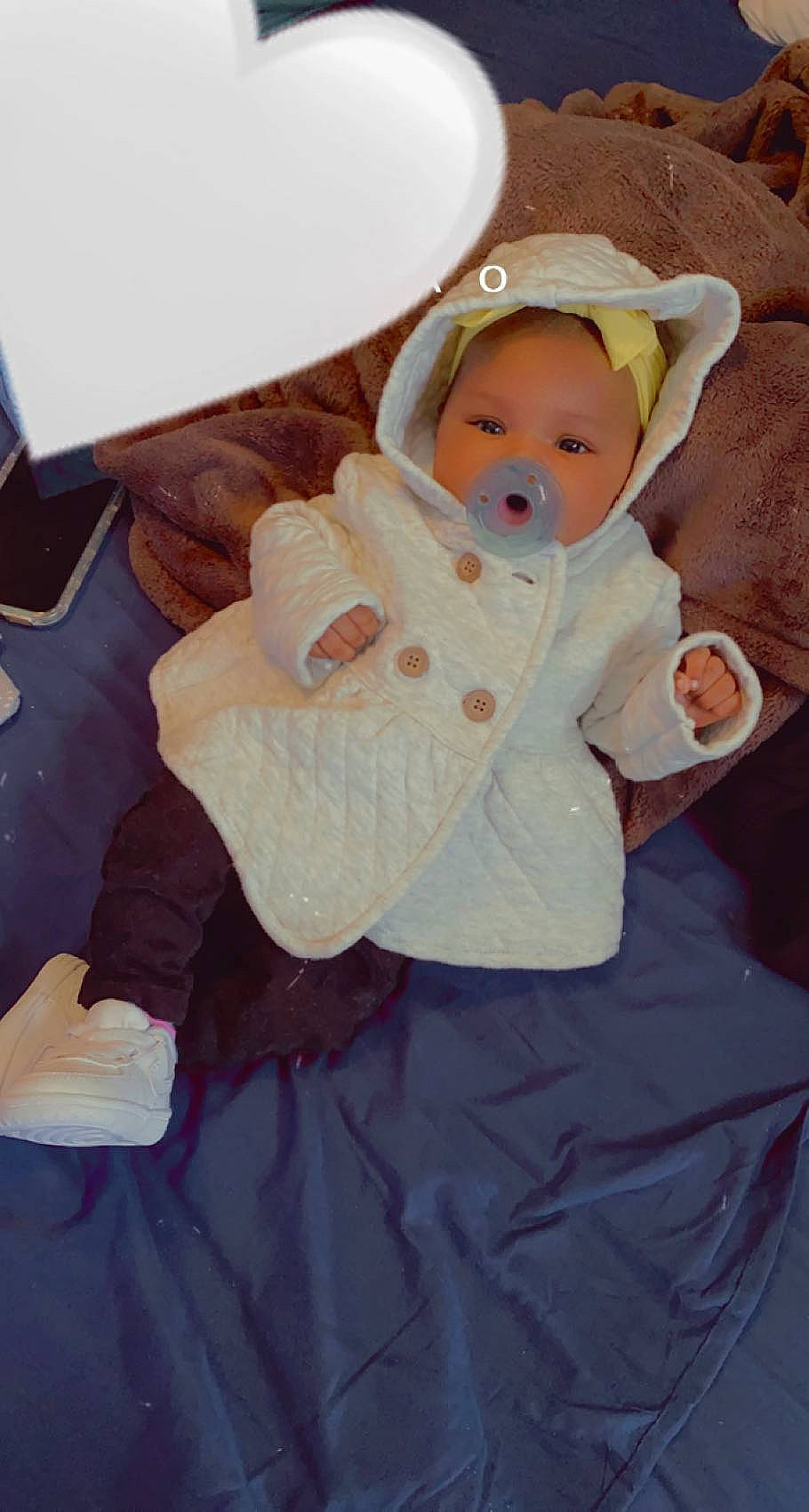 Kamelia is registered to the contest to win money with this photo: baby, baby_toddler_clothing, cap, cheek, child, comfort, face, fashion_accessory, happy, hat, headgear, linens, person, pink, purple, sitting, skin, sleeve, textile, toddler