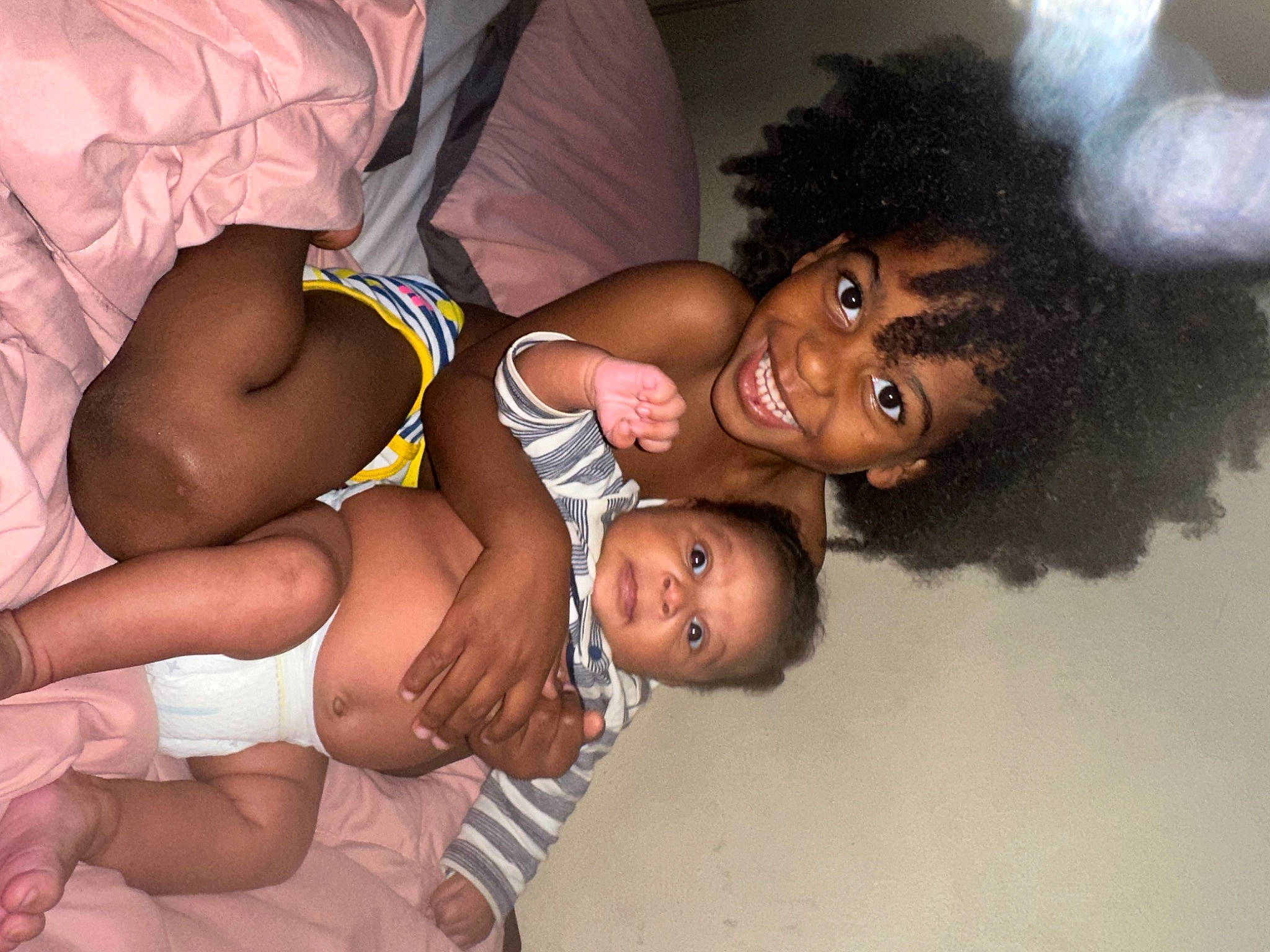 Auggi is registered to the contest to win money with this photo: abdomen, afro, barechested, black_hair, chest, child, elbow, event, flash_photography, fun, happy, human_body, interaction, jewellery, joy, muscle, person, skin, smile, stomach