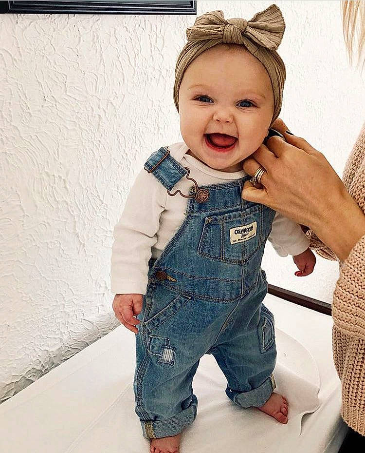 Cedar is registered to the contest to win money with this photo: baby, blond, cheek, child, child_model, clothing, denim, ear, jacket, jeans, outerwear, overall, person, pocket, product, sleeve, standing, textile, toddler, trousers