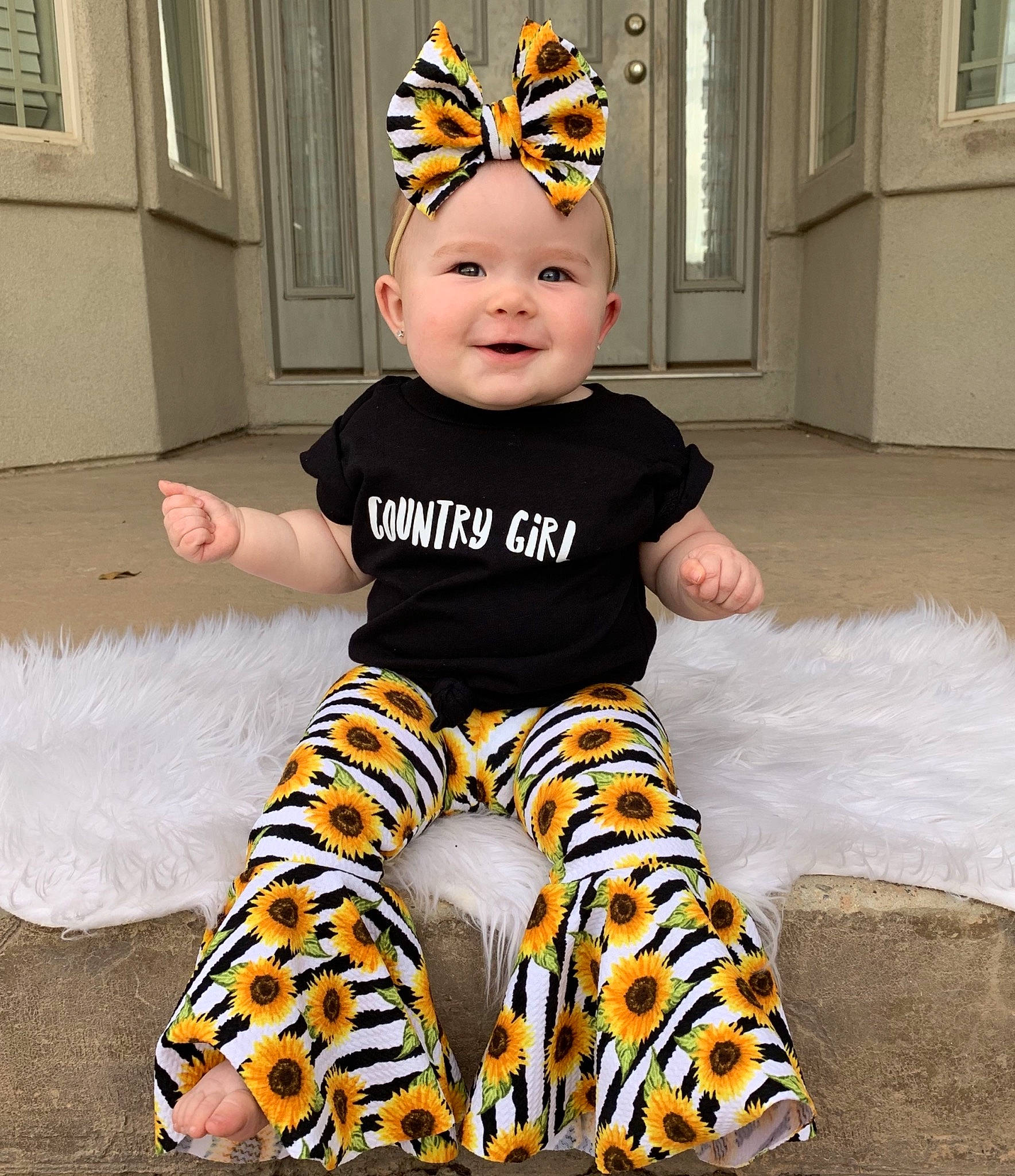 Cedar is registered to the contest to win money with this photo: baby, baby_bloomers, baby_toddler_clothing, child, costume, costume_accessory, headwear, joy, pattern, person, toddler, yellow