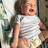 baby, infant, smiling, laughing, onesie, diaper, winnie_the_pooh, chubby, cute, lying_down, striped, changing_pad, happy, skin, arm, leg, indoor, child, person, closeup