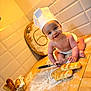 baby, chef_hat, bread, whisk, kitchen, flour, cutting_board, basket, smiling, cooking, wooden_counter, tile_wall, diaper, playful, baking, infant, dough, food, cooking_utensil, happy