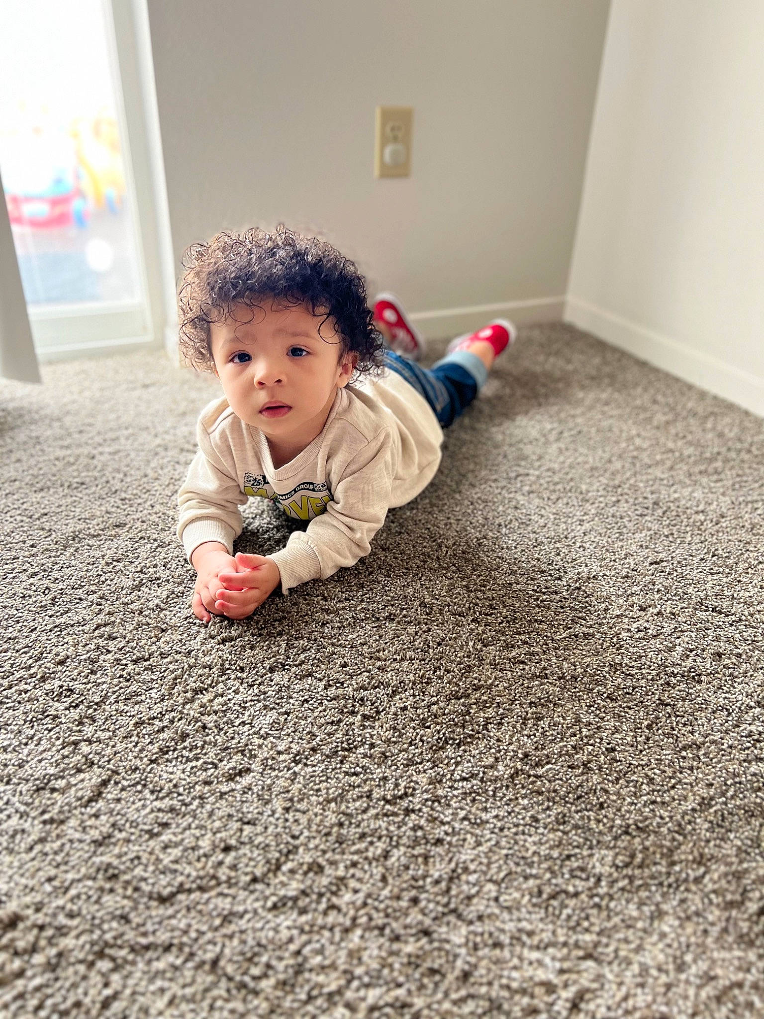 Zaylen is registered to the contest to win money with this photo: asphalt, baby, baby_toddler_clothing, carpet, child, crawling, floor, flooring, fun, grass, grey, hardwood, human_leg, person, road_surface, sitting, skin, sleeve, toddler, wood