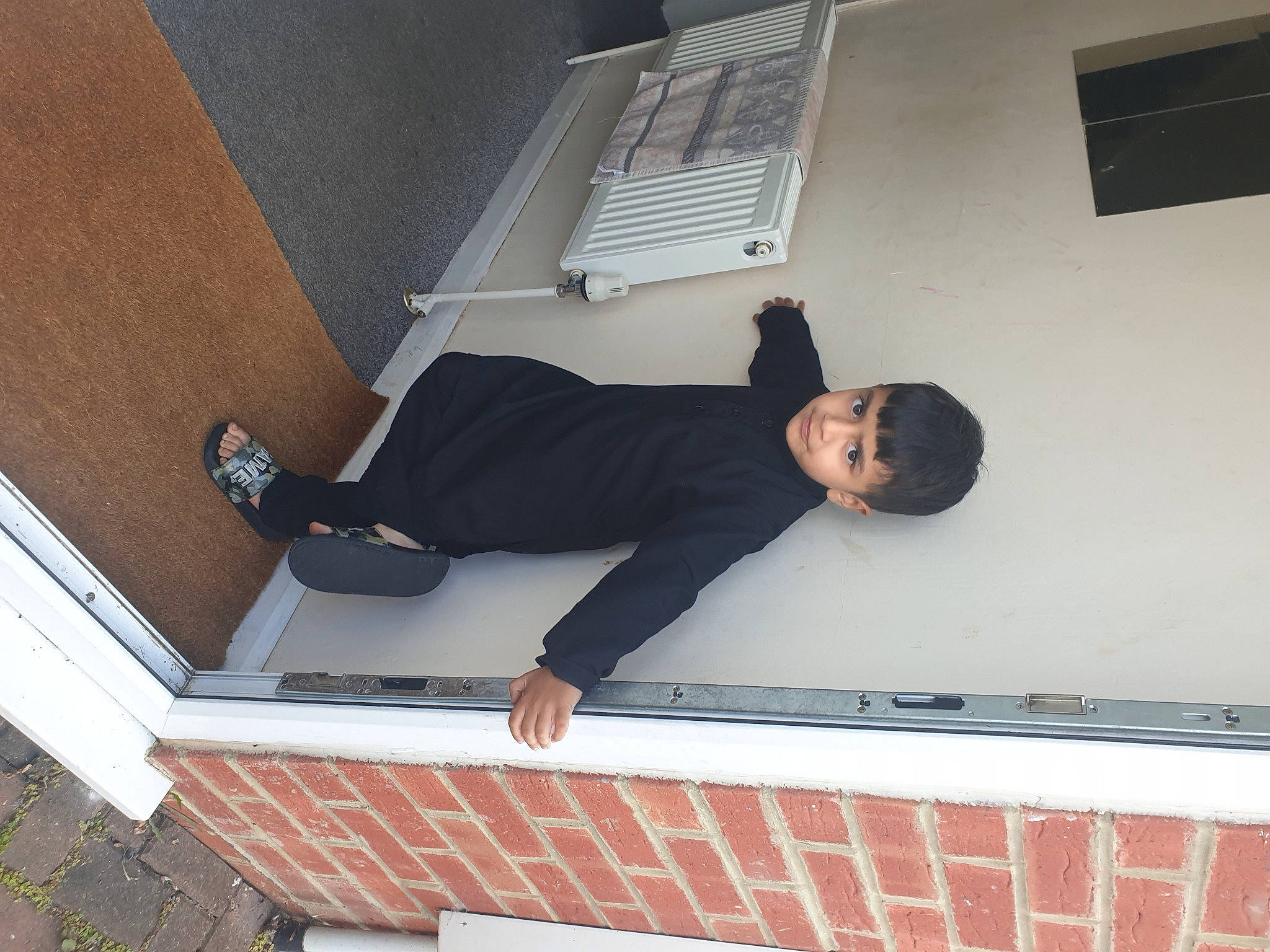 Hassan is registered to the contest to win money with this photo: blazer, brickwork, collar, comfort, composite_material, dress_shirt, elbow, human_leg, knee, person, photograph, rectangle, sitting, sleeve, t_shirt, thigh, waist, white_collar_worker, window, wrist