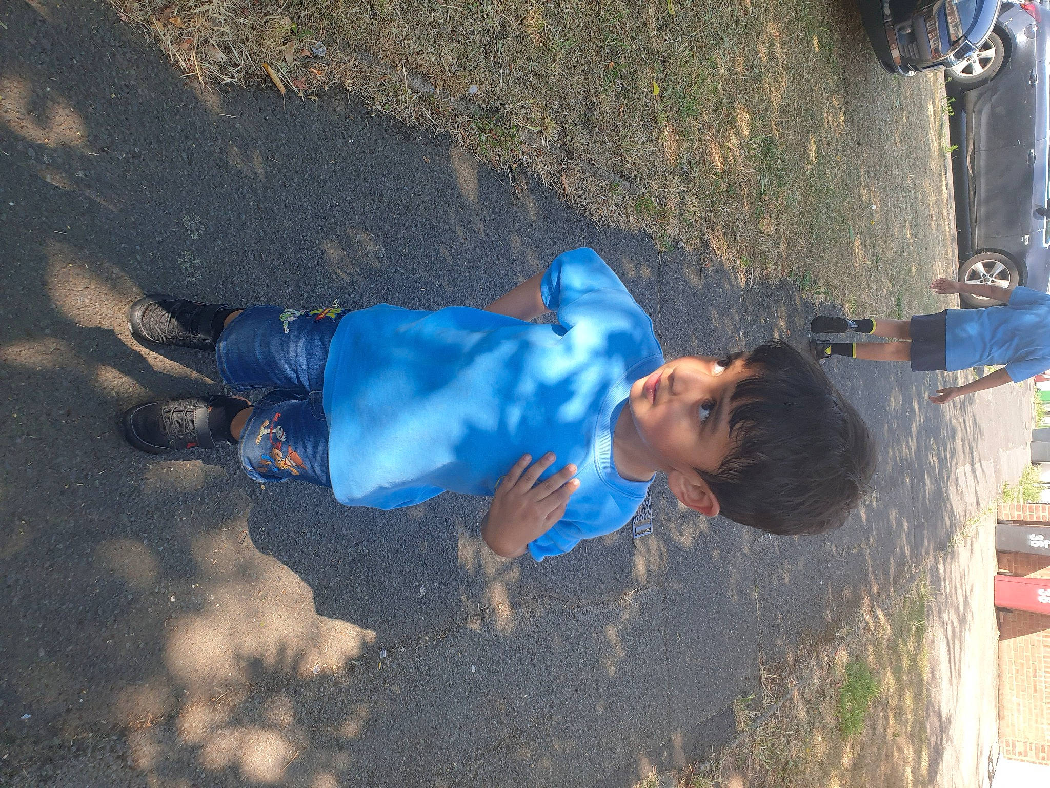 Hassan joined the competition — help win amazing prizes! asphalt, azure, blue, child, concrete, denim, electric_blue, fun, hat, landscape, leisure, pedestrian, person, recreation, shadow, soil, toddler, walking_shoe