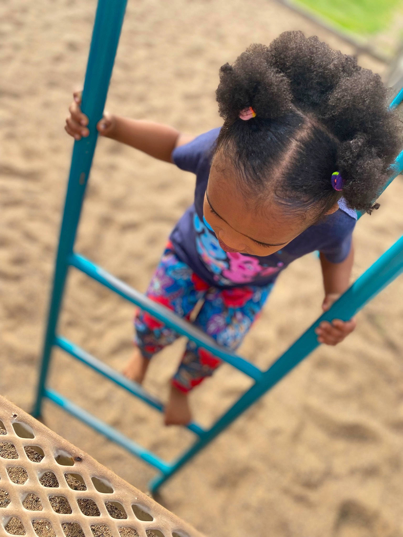 Arielle is registered to the contest to win money with this photo: active_shorts, beach, calf, competition, competition_event, electric_blue, fun, knee, leisure, mammal, outdoor_play_equipment, person, photograph, play, recreation, sand, shorts, soil, sports, t_shirt