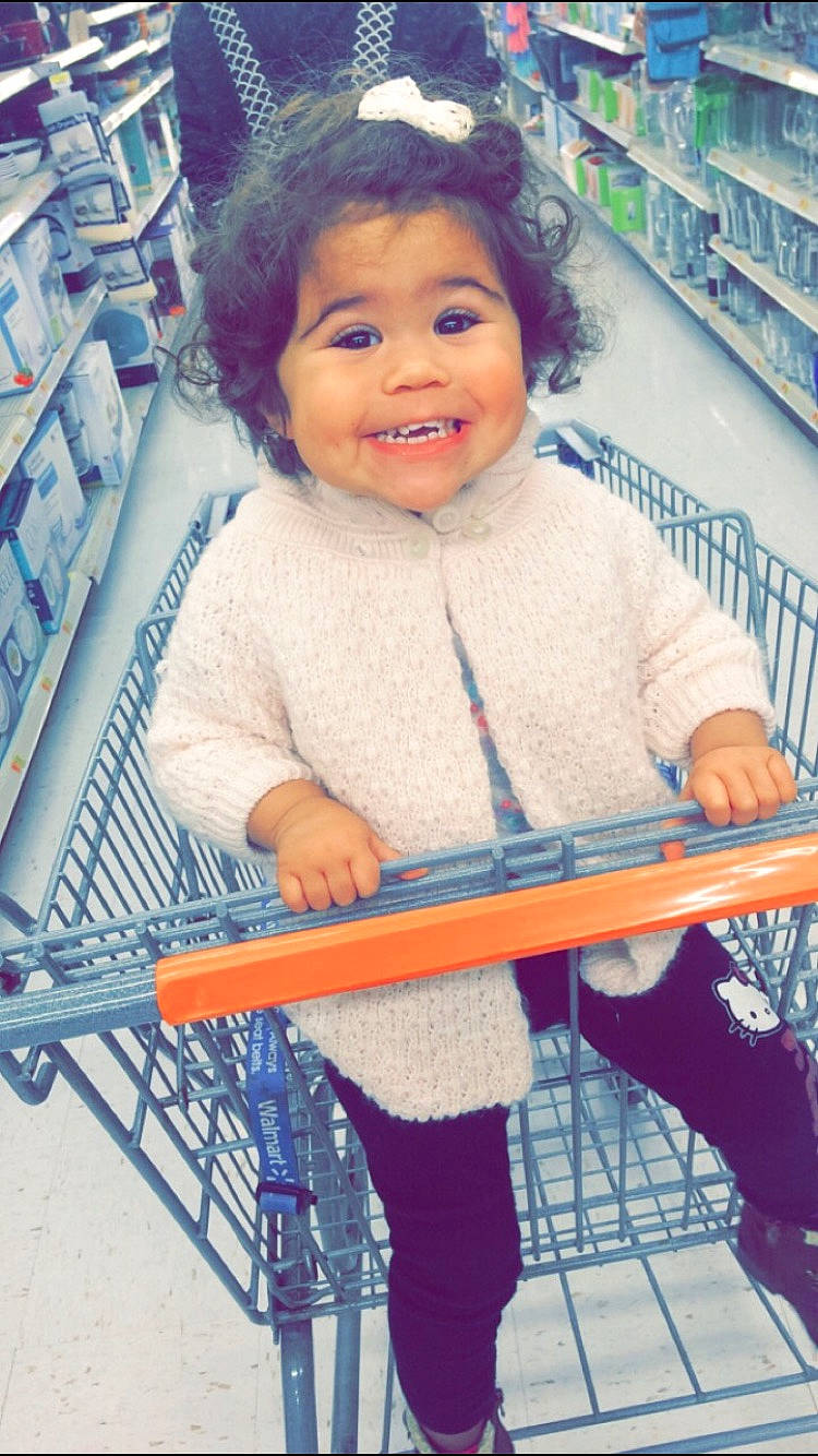 Lyric is registered to the contest to win money with this photo: baby, baby_toddler_clothing, blue, child, electric_blue, fun, happy, iris, joy, leg, organ, person, photograph, shelf, shopping_cart, skin, sleeve, smile, standing, t_shirt