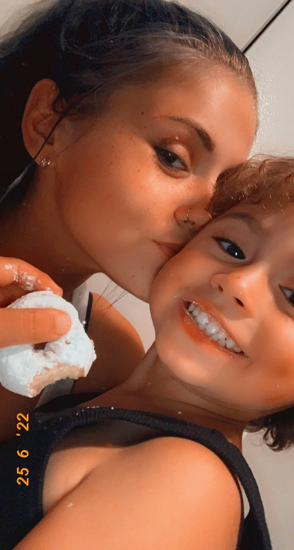 Liam is registered to the contest to win money with this photo: cheek, chin, eyebrow, eyelash, flash_photography, friendship, fun, gesture, happy, human, interaction, iris, joy, kiss, lip, mouth, nose, people_in_nature, person, selfie