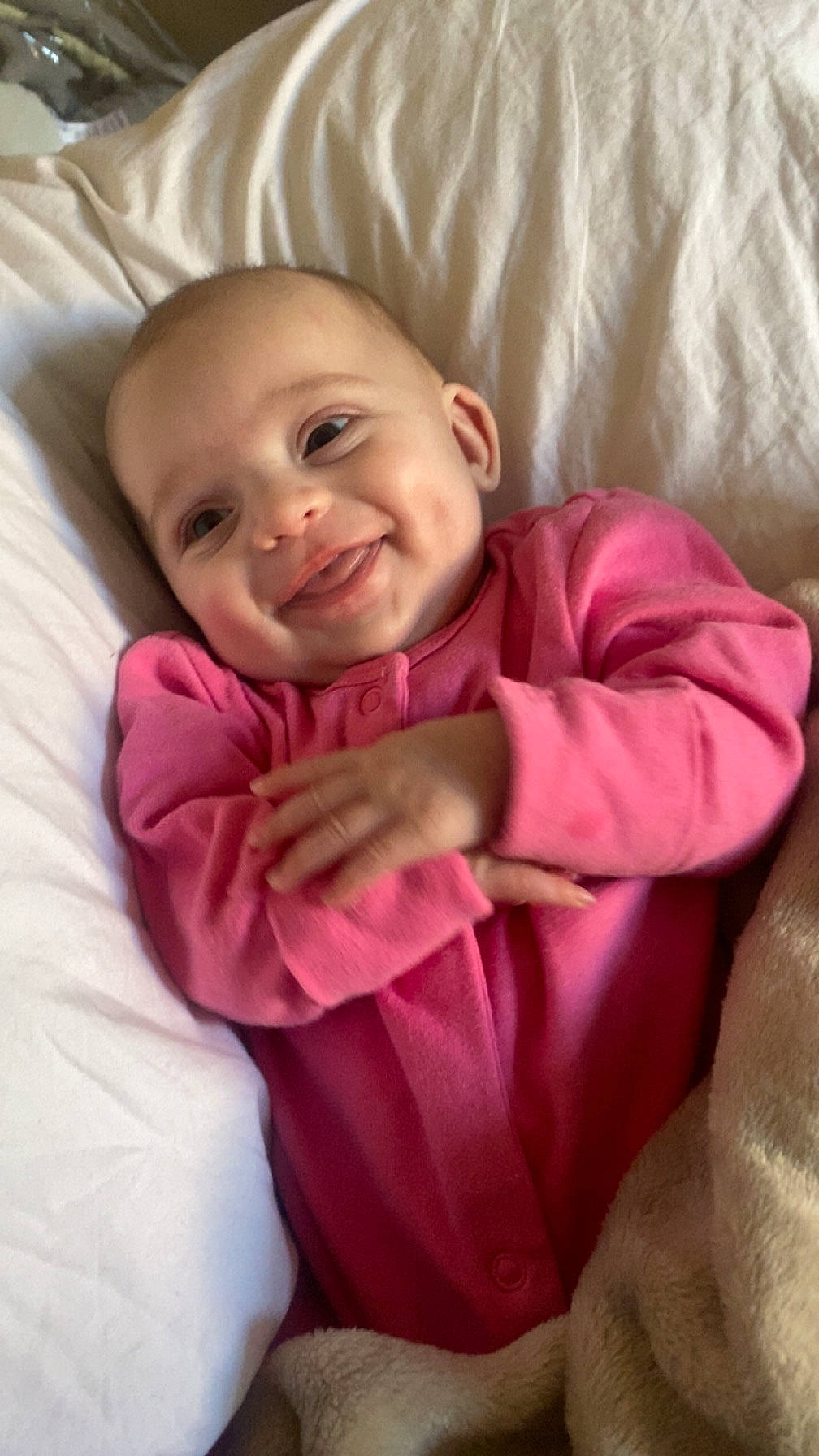 Arabella joined the competition — help win amazing prizes! baby_toddler_clothing, cheek, comfort, fun, gesture, happy, iris, joy, laugh, linens, lip, magenta, nose, outerwear, person, pink, sitting, sleeve, smile, thumb