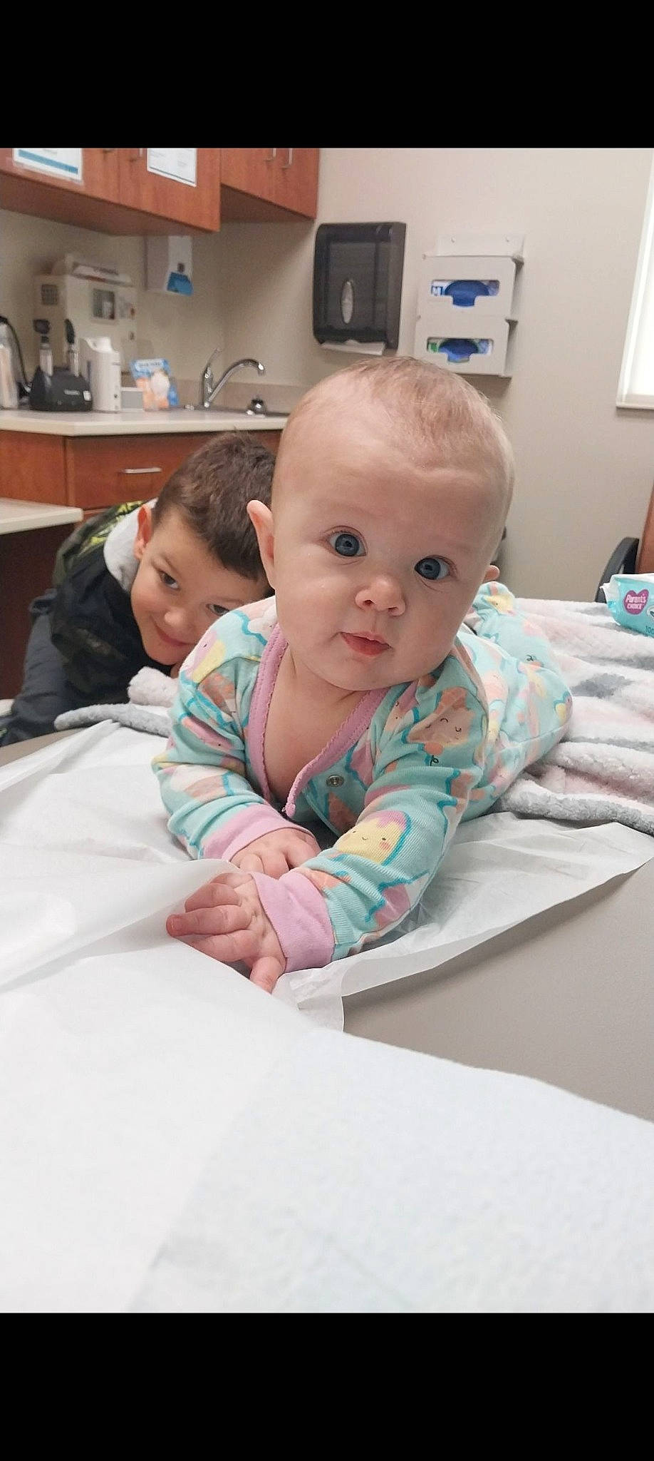 Salem is registered to the contest to win money with this photo: baby, baby_toddler_clothing, cabinetry, child, comfort, countertop, eye, face, flooring, happy, home_appliance, joy, kitchen, kitchen_appliance, kitchen_stove, linens, person, room, sitting, skin