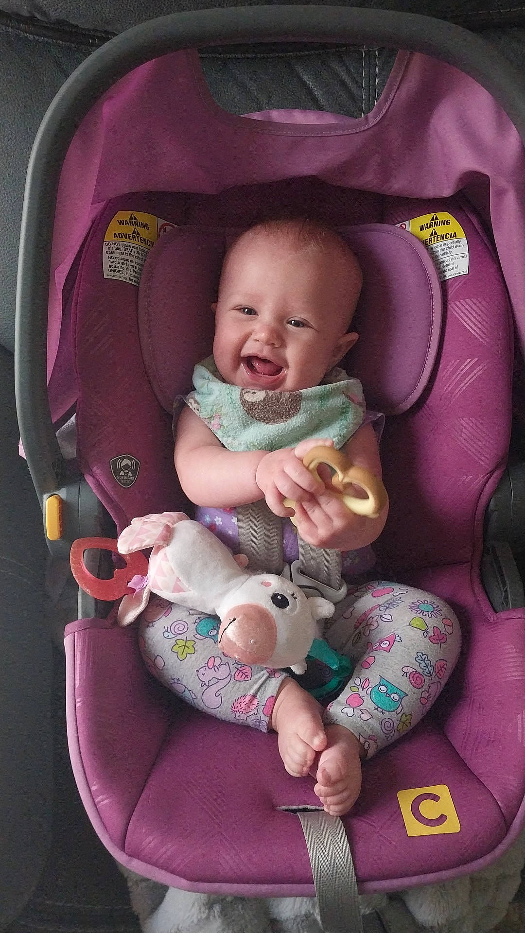 Salem is registered to the contest to win money with this photo: baby, baby_carriage, baby_in_car_seat, baby_products, baby_toddler_clothing, car_seat, cheek, child, comfort, facial_expression, finger, lap, mouth, person, pink, product, purple, sitting, skin, smile