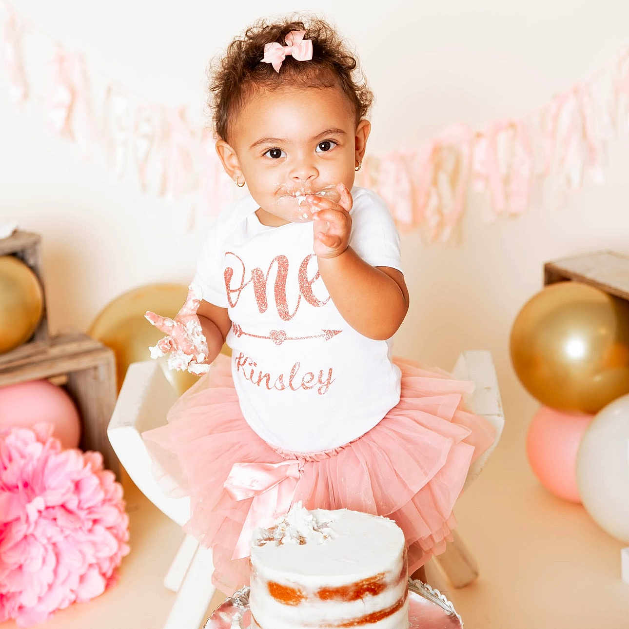 Kinsley Grace Morris is registered to the contest to win money with this photo: baby, balloons, birthday, cake, cake_smash, cake_stand, celebration, child, cute, frosting, happy, indoor, party_decor, person, pink_bow, pink_tutu, sitting, smiling, toddler, white_shirt