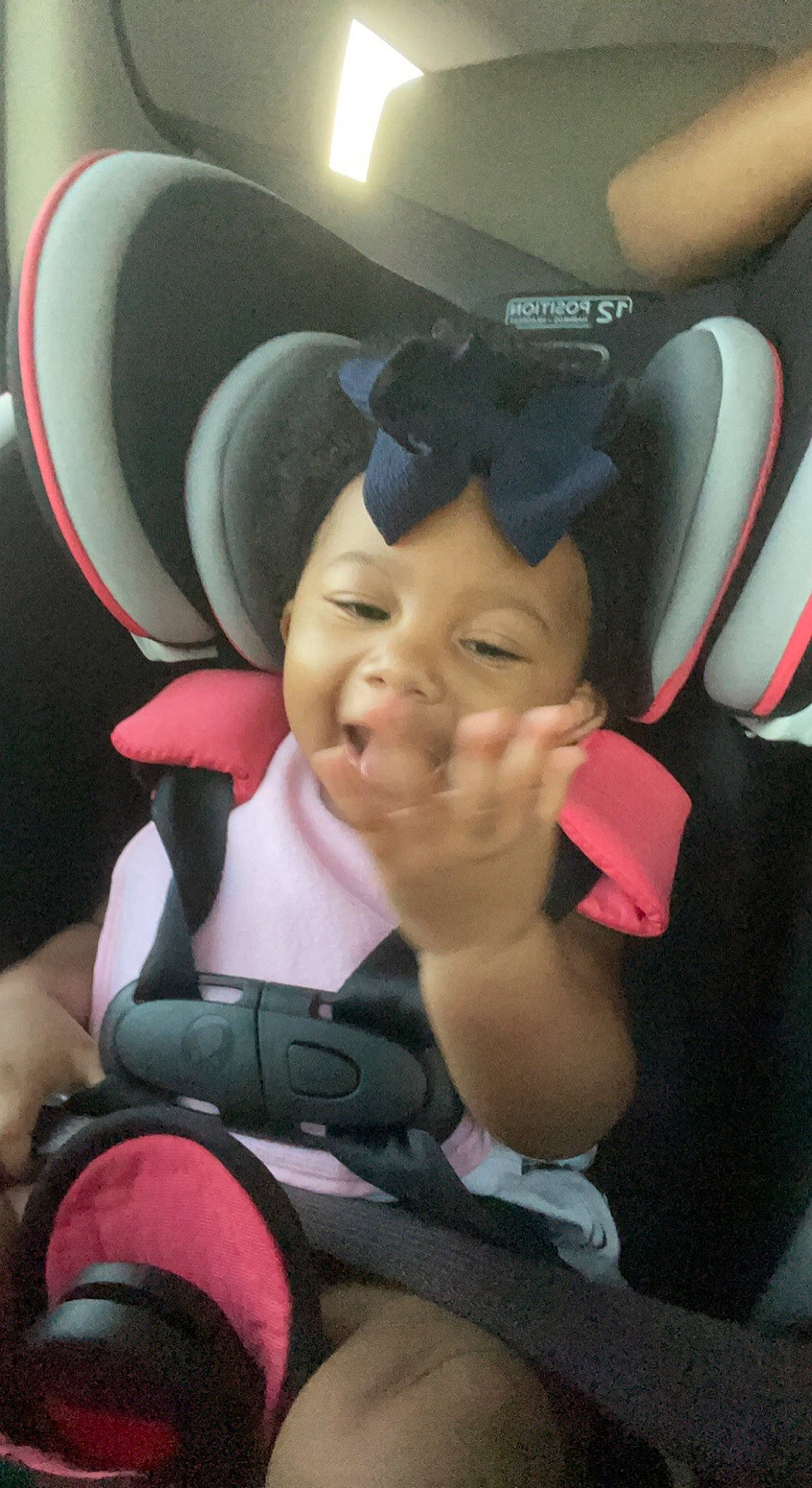 Braylee joined the competition — help win amazing prizes! baby, baby_carriage, baby_in_car_seat, car_seat, comfort, cool, finger, gesture, happy, hat, head_restraint, headgear, mouth, person, personal_protective_equipment, pink, seat_belt, steering_wheel, thumb, toddler