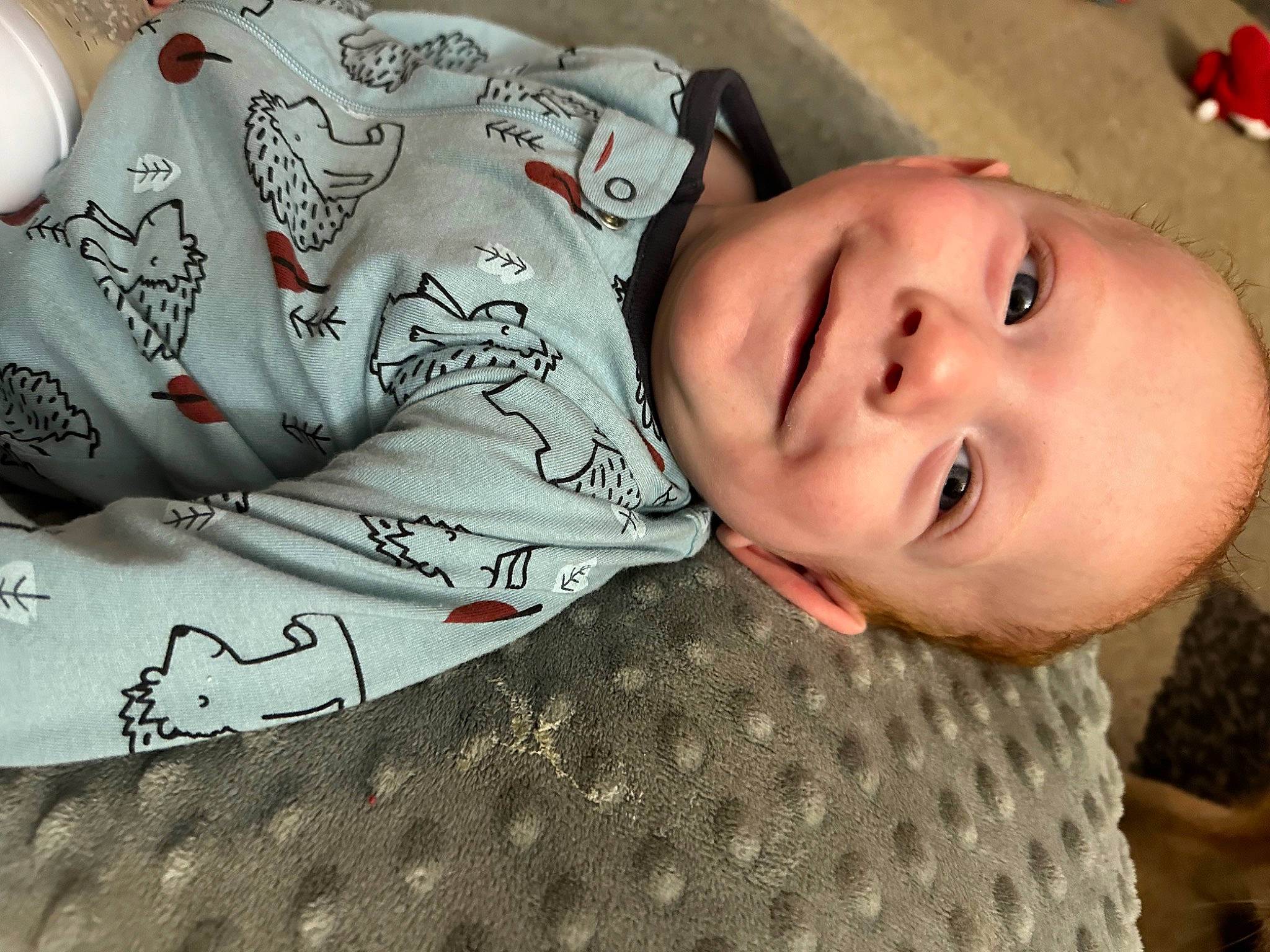 Dean is registered to the contest to win money with this photo: baby, baby_toddler_clothing, bedding, cheek, child, comfort, cool, drinkware, happy, head, joy, linens, lip, mouth, neck, nose, pattern, person, skin, sleeve