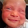 Jessie-June is registered to the contest to win money with this photo: baby, newborn, face, smile, closeup, infant, skin, expression, person, cheeks, clothing, indoors, cute, human, head, young, portrait, happy, squinting, child