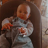 Lucas a rejoint le concours — aidez-le/la à gagner de superbes lots ! baby, baby_seat, blanket, child, clothing, comfort, curious, cute, expression, floor_tiles, furniture, hand_drawn_heart, hanging_toys, home, indoor, infant, seated, small_fingers, soft_lighting, toy