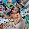 baby, sleeping, blanket, bedding, toy_story, buzz_lightyear, toy, cartoon, child, crib, comfort, nursery, cute, infant, rest, pillow, colorful, soft, peaceful, relaxation