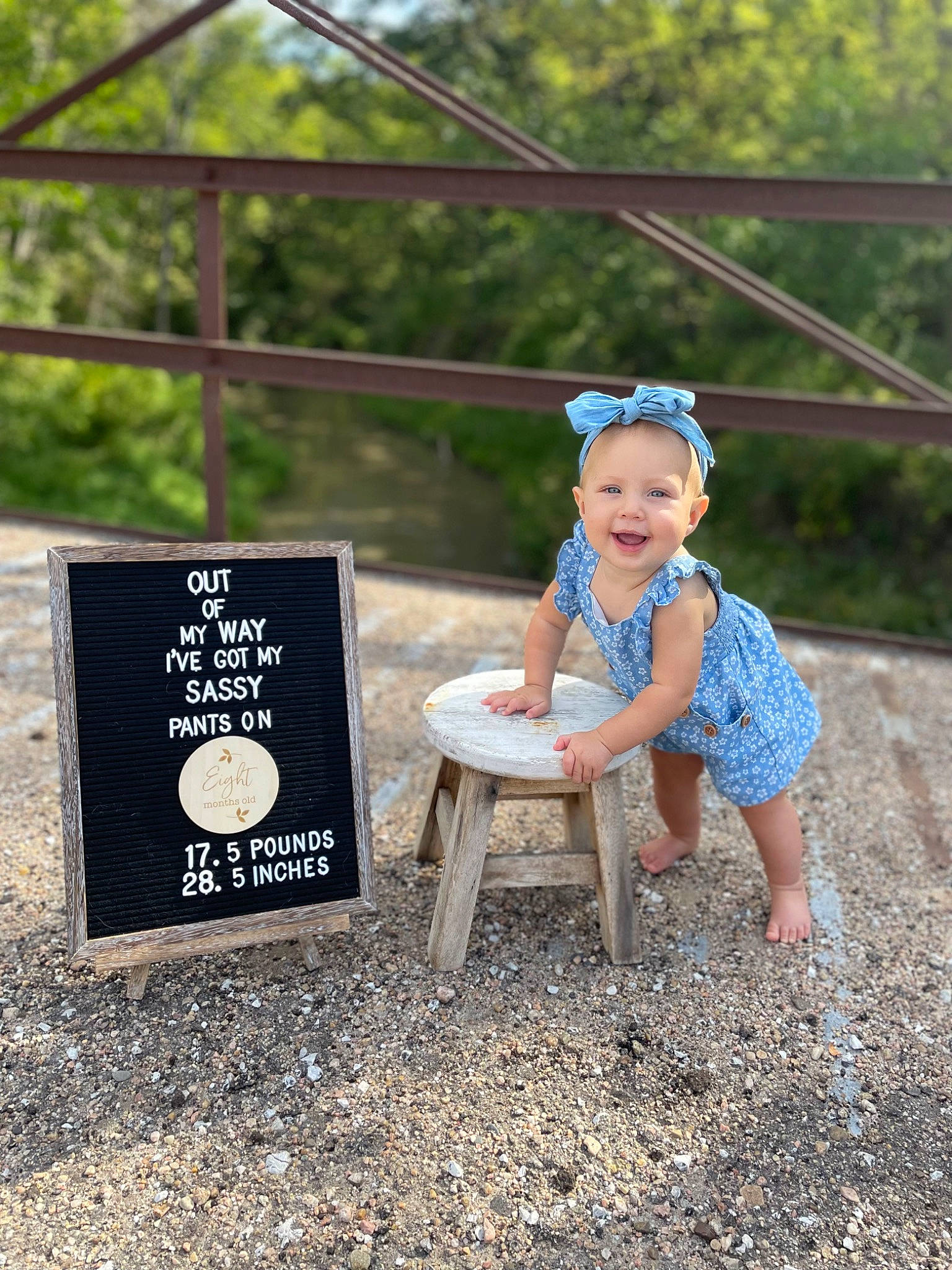 Jaylee is registered to the contest to win money with this photo: baby_toddler_clothing, dress, face, fun, grass, happy, hat, joy, landscape, leaf, leg, leisure, outdoor_furniture, people_in_nature, person, recreation, sand, shorts, smile, soil