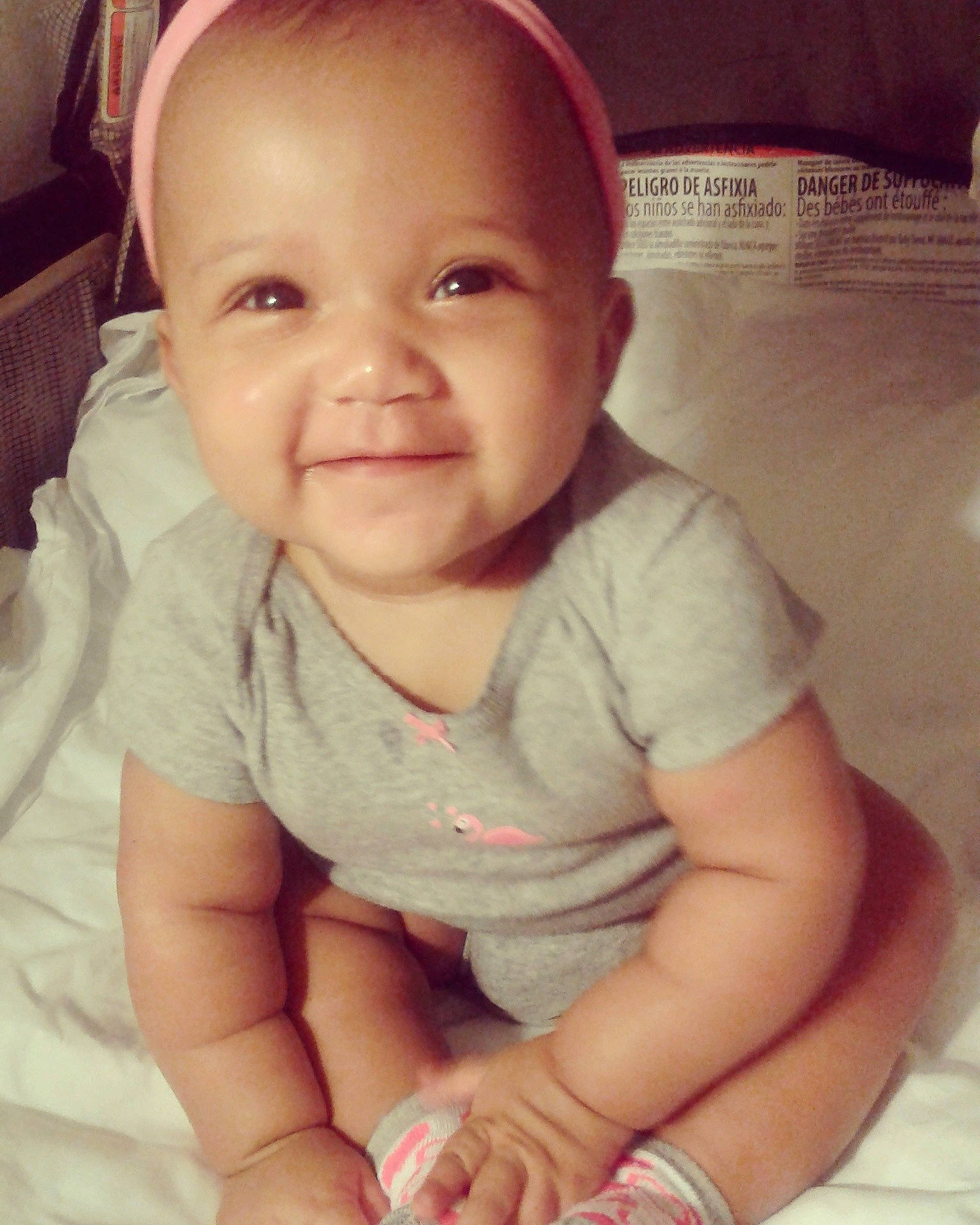 Khali'Ah is registered to the contest to win money with this photo: cheek, child, chin, day, eye, face, finger, girl, hand, head, human_hair_color, infant, joy, lip, mouth, nose, person, product, sitting, skin