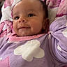 Sariah joined the competition — help win amazing prizes! baby, infant, smiling, face, blanket, clothing, purple, onesie, clouds, stars, cute, child, portrait, lying_down, soft, indoor, happy, young, person, cozy