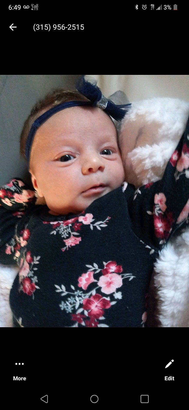 Eleanora is registered to the contest to win money with this photo: baby, baby_toddler_clothing, cheek, child, chin, eye, eyelash, flash_photography, fur, happy, iris, lip, magenta, nose, person, petal, pink, plant, skin, sleeve