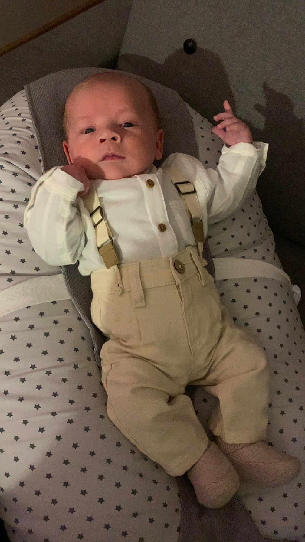 Mayronn participe au concours pour gagner de l'argent avec cette photo : baby, infant, suspenders, pants, cushion, star_pattern, clothing, person, indoor, face, head, hand, footwear, socks, relaxing, portrait, cute, newborn, fabric, soft