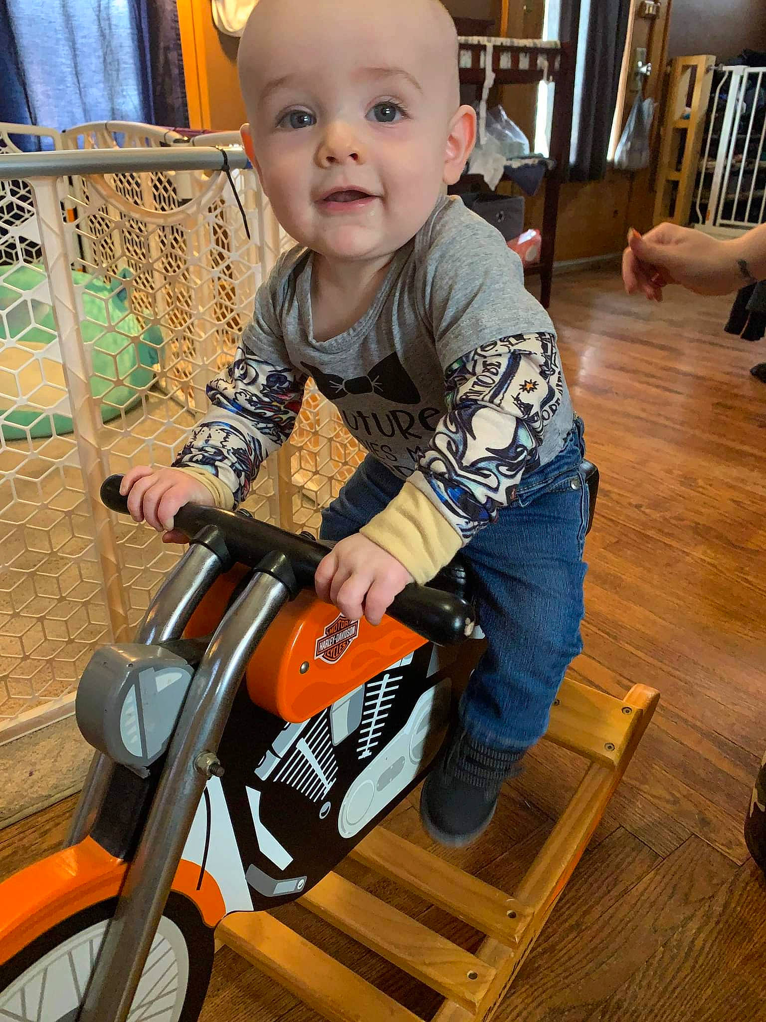 Danny joined the competition — help win amazing prizes! baby, baby_toddler_clothing, bicycle_tire, child, curtain, flooring, fun, hardwood, person, riding_toy, sitting, smile, tire, toddler, varnish, vehicle, wheel, wood, wood_flooring, wood_stain