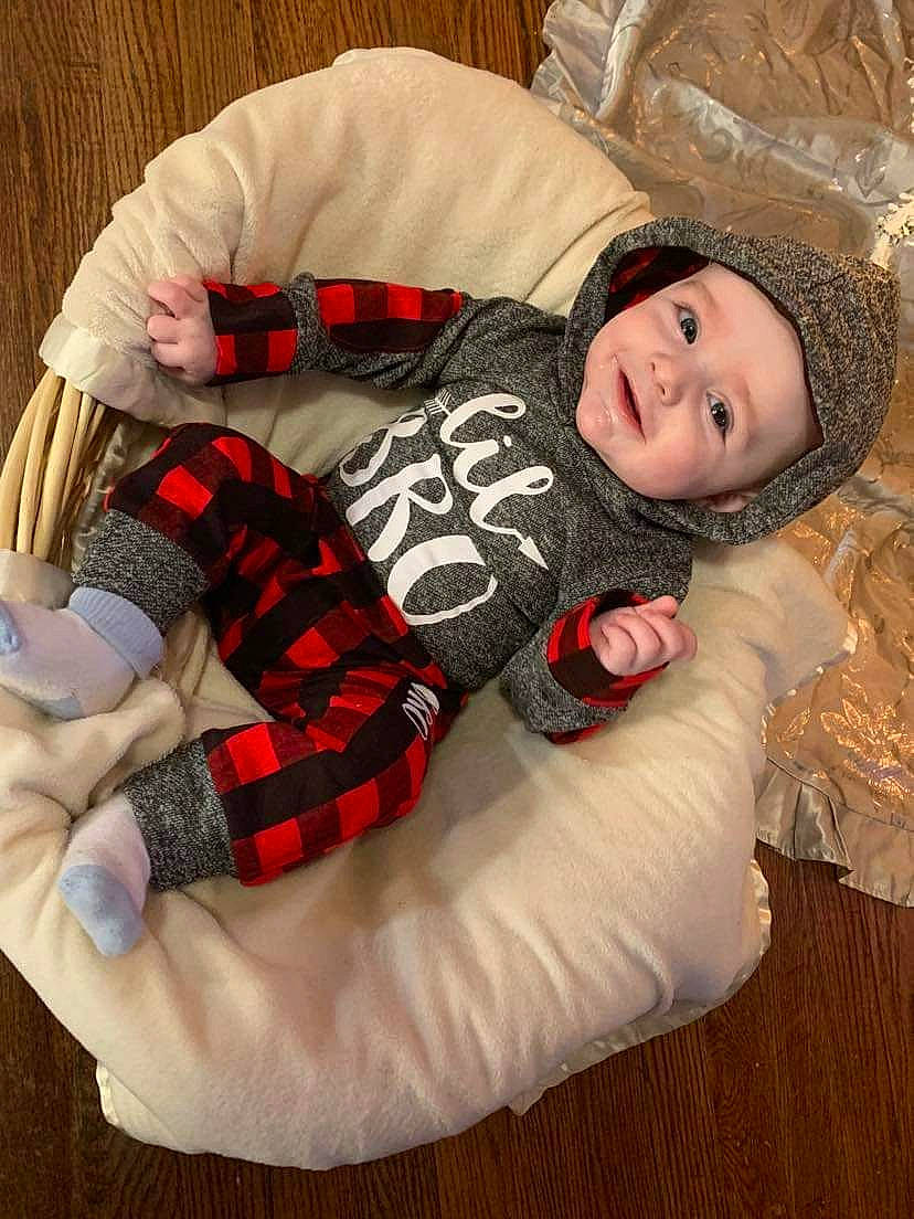 Danny joined the competition — help win amazing prizes! baby_sleeping, baby_toddler_clothing, child, comfort, couch, flooring, fur, head, headwear, joy, lap, linens, outerwear, pattern, person, plaid, sitting, sleeve, smile, tartan