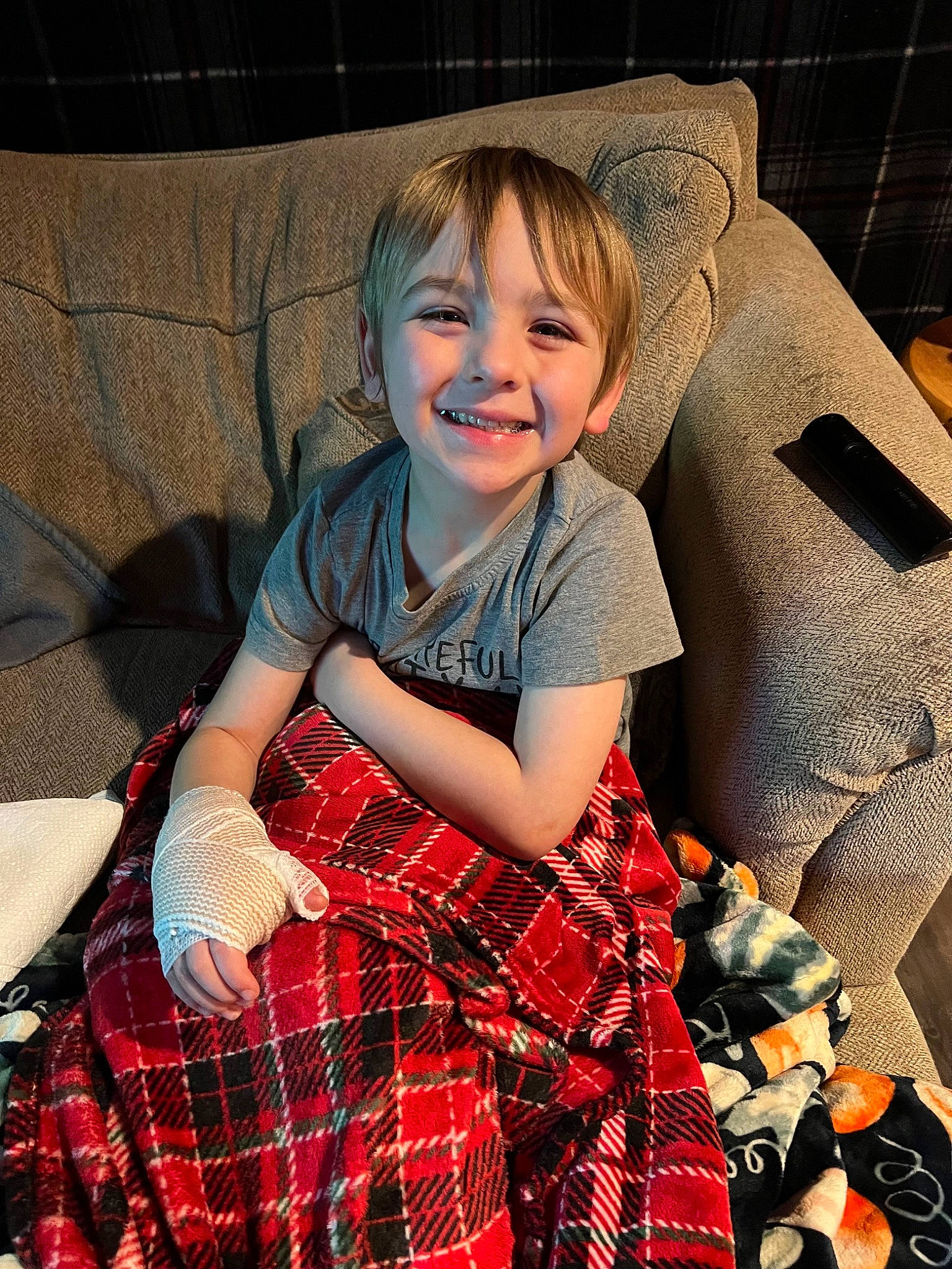 Jack joined the competition — help win amazing prizes! baby_toddler_clothing, chair, child, comfort, couch, dress, event, fun, happy, human_leg, joy, lap, pattern, person, plaid, sitting, sleeve, smile, tartan, textile