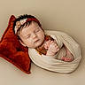 baby, sleeping, newborn, headband, pillow, blanket, wrapped, infant, peaceful, soft, cute, resting, portrait, hands, feet, cozy, fabric, skin, indoor, child