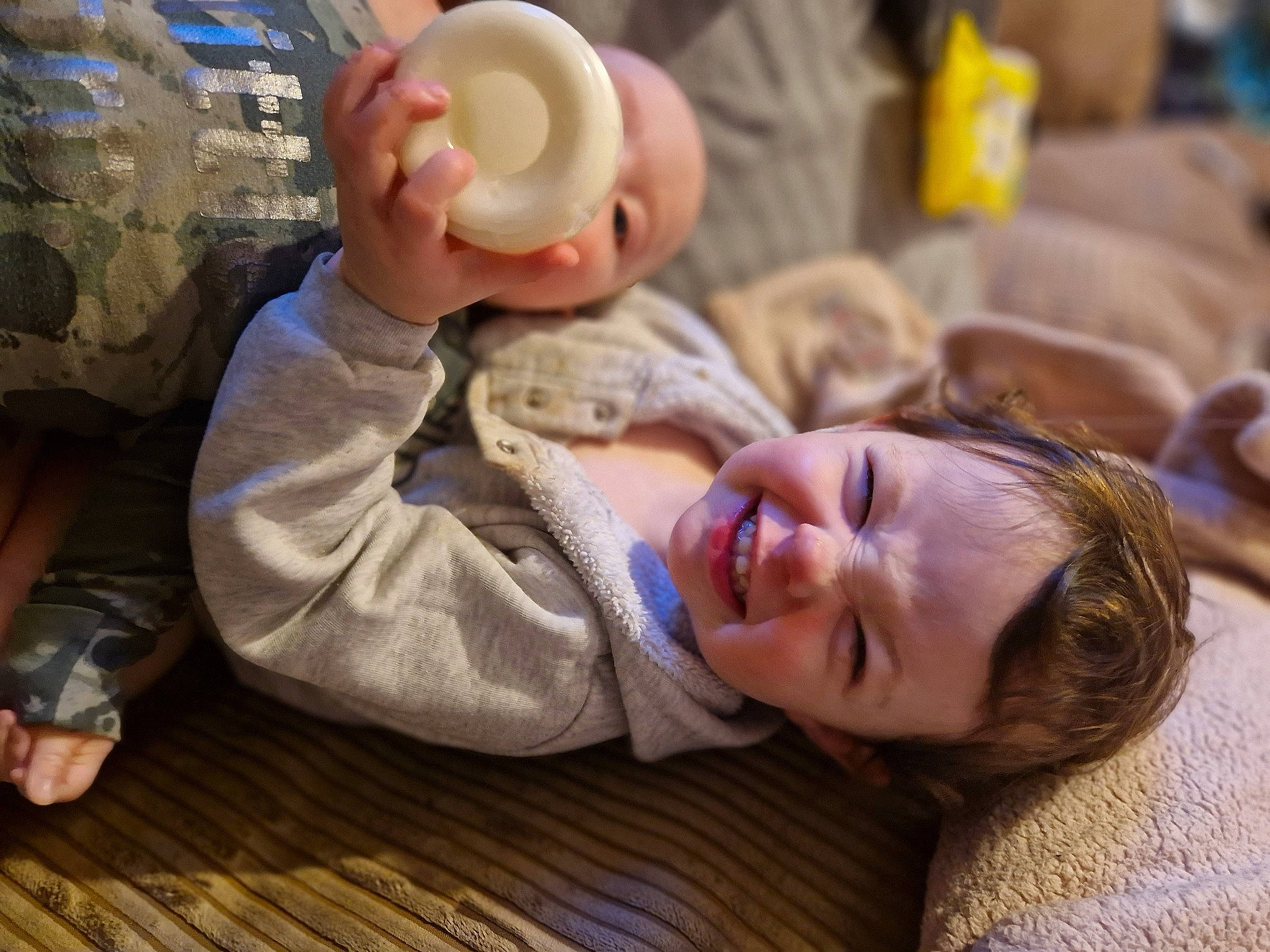 Harmony is registered to the contest to win money with this photo: baby, baby_toddler_clothing, child, comfort, floor, flooring, fun, gesture, happy, hardwood, laugh, leisure, person, room, sitting, smile, toddler, varnish, wood, wood_flooring