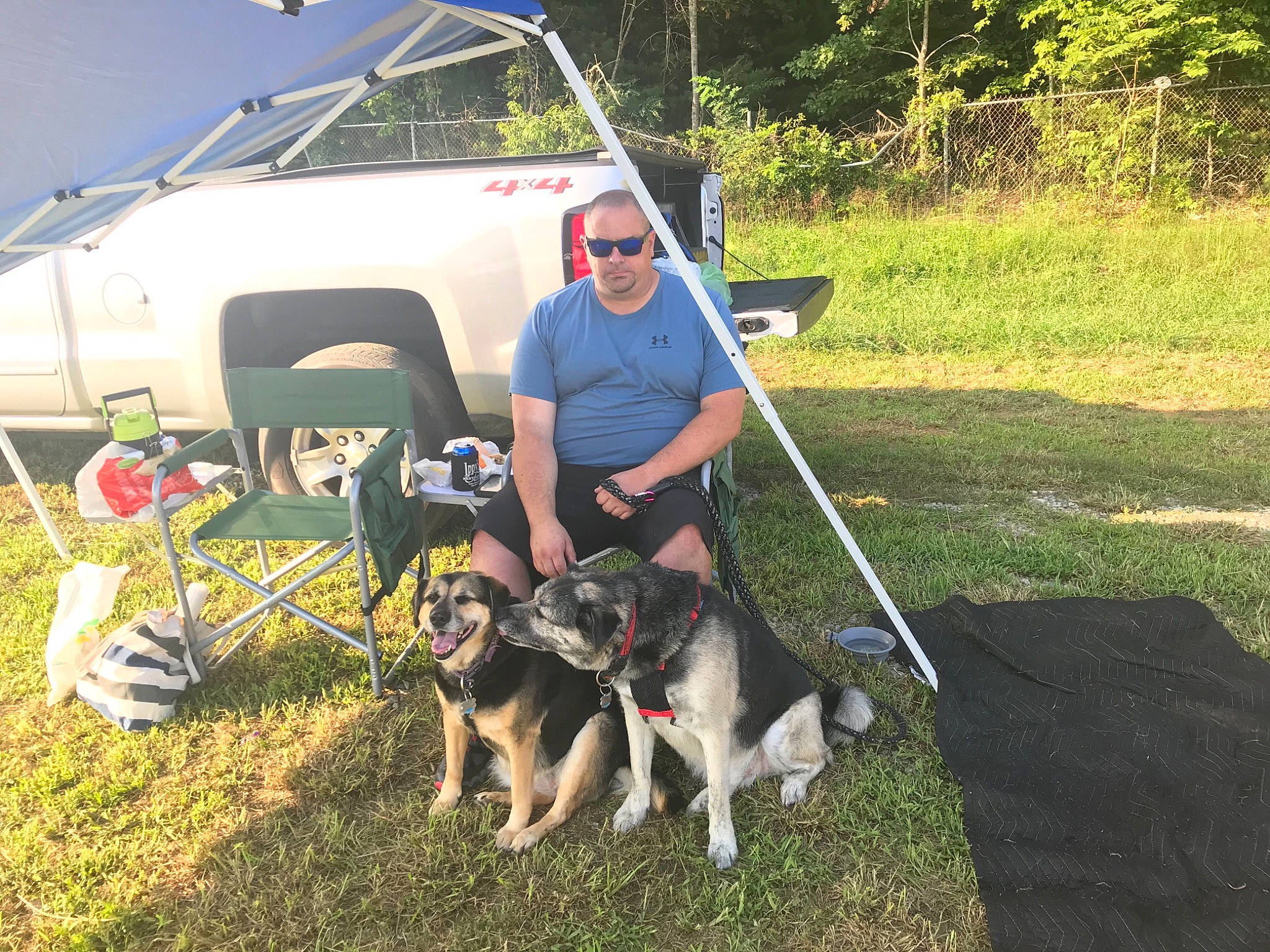 Abby N Hans is registered to the contest to win money with this photo: aircraft, aviation, camping, carnivore, dog, dog_breed, general_aviation, grass, leash, motor_vehicle, outdoor_recreation, plant, recreation, shorts, sled_dog, tire, tree, vehicle, wheel, window