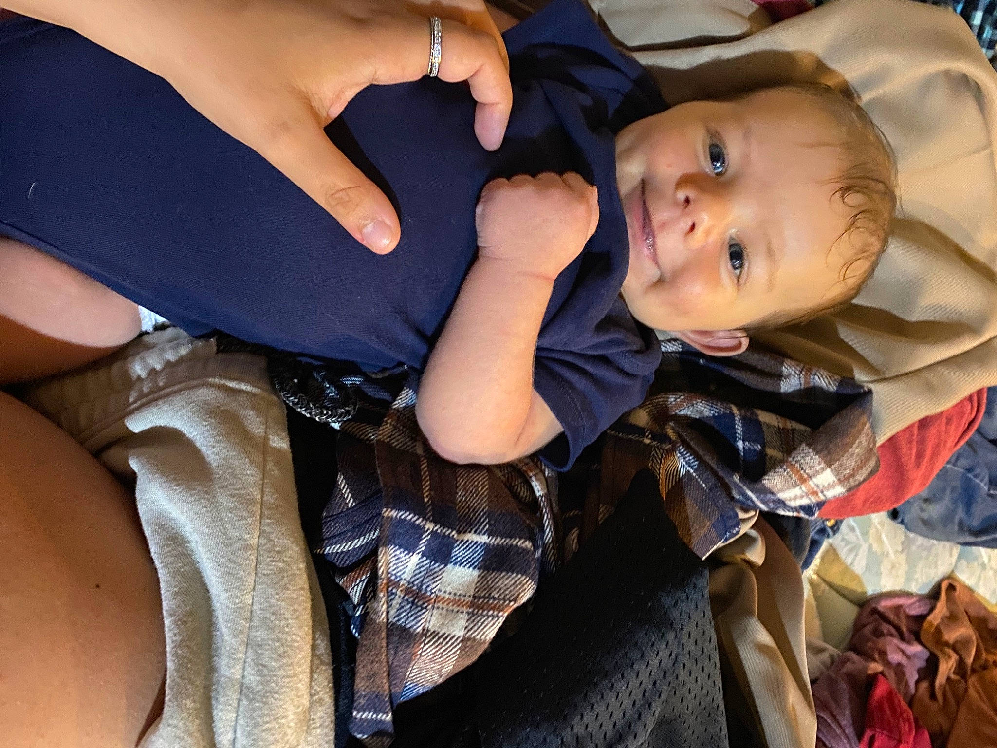 Phoenix joined the competition — help win amazing prizes! arm, baby, baby_toddler_clothing, child, comfort, eye, fun, gesture, grass, hand, happy, head, human_leg, joy, person, plant, sitting, smile, tartan, thigh