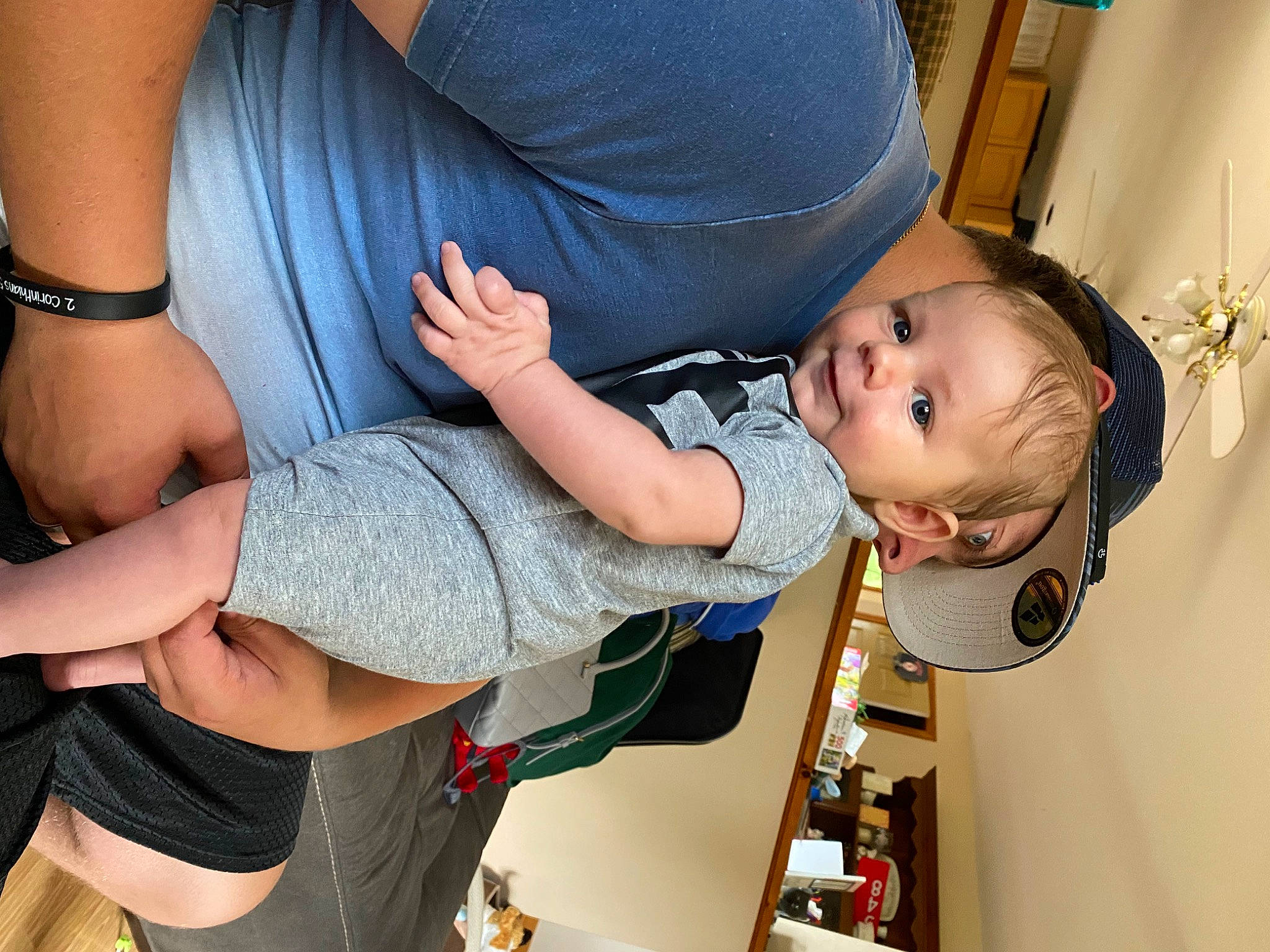 Phoenix is registered to the contest to win money with this photo: arm, baby, baby_toddler_clothing, child, comfort, door, elbow, electric_blue, fun, gesture, happy, human_leg, joint, knee, leg, nail, person, smile, thigh, toddler