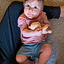 Emma joined the competition — help win amazing prizes! toddler, child, plush_toy, carpet, person, blue_eyes, pink_shirt, shorts, barefoot, indoor, soft_toy, cute, candid, family, comfort, legs, skin, hair, sitting, holding