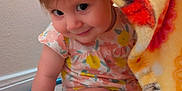Emma joined the competition — help win amazing prizes! toddler, child, baby, blanket, carpet, floor, hand, face, smile, expression, candid, indoors, cute, clothing, pattern, colorful, playful, young, person, skin