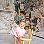 Berkley is registered to the contest to win money with this photo: baby, child, toddler, portrait, smile, wooden_chair, easter_bunny, easter_eggs, pastel_colors, pink_dress, hair_bow, socks, shoes, studio_backdrop, props, standing, happy, floral, decorative_background, playful