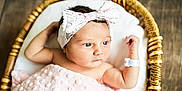 Elodie joined the competition — help win amazing prizes! baby, newborn, blanket, basket, headband, pink, infant, cute, portrait, sleeping, soft, cozy, wooden_floor, resting, child, adorable, small, wrapped, lying, indoor