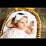 baby, newborn, blanket, basket, headband, pink, infant, cute, portrait, sleeping, soft, cozy, wooden_floor, resting, child, adorable, small, wrapped, lying, indoor
