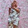 baby, infant, blanket, pink, hearts, headband, socks, clothing, cute, lying_down, soft, pattern, animal_print, koala, fabric, newborn, child, portrait, indoors, resting