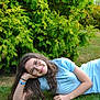Sarah participe au concours pour gagner de l'argent avec cette photo : child, girl, glasses, grass, greenery, outdoor, smile, casual, nature, relaxing, summer, blue_clothing, long_hair, happy, portrait, young, person, leisure, daylight, park