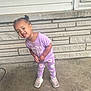 Ezlynn joined the competition — help win amazing prizes! brick_wall, casual_clothing, child, concrete_floor, curious, cute, daylight, girl, hair_buns, leggings, outdoor, person, portrait, purple_clothing, smiling, sneakers, standing, toddler, tshirt, young_child